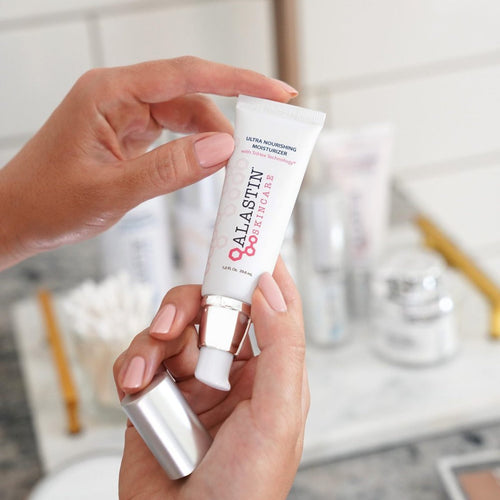 Alastin Ultra Nourishing Moisturizer with TriHex Technology™ in a white jar, smooth cream texture, with a clean label and lid.