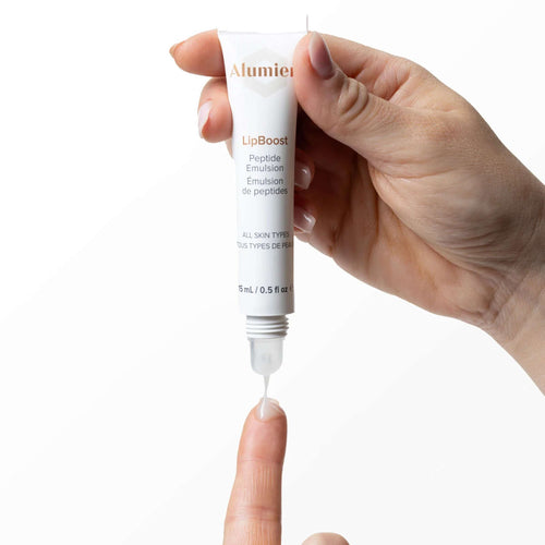 Wedoskin Alumier LipBoost 15ml lip treatment tube for lips, part of eyes, neck & lips skincare line, shown in the image.