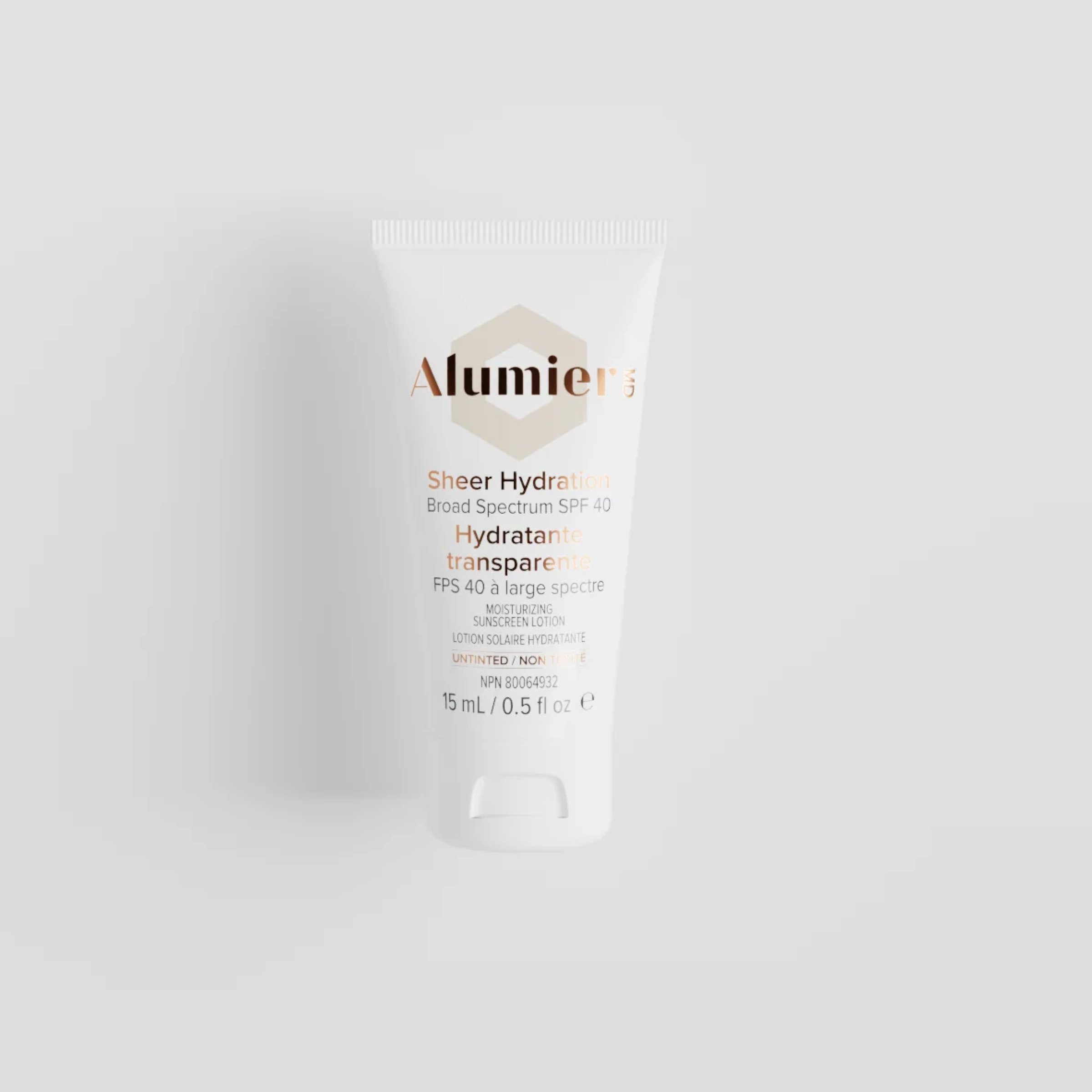 Travel size AlumierMD Sheer Hydration SPF 40 untinted broad spectrum sunscreen from wedoskin, 15ml tube with a white cap.
