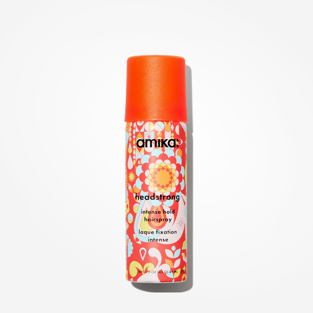Travel-size Amika Headstrong Intense Hold Hairspray by wedoskin, featuring a spray bottle for strong, long-lasting hold.