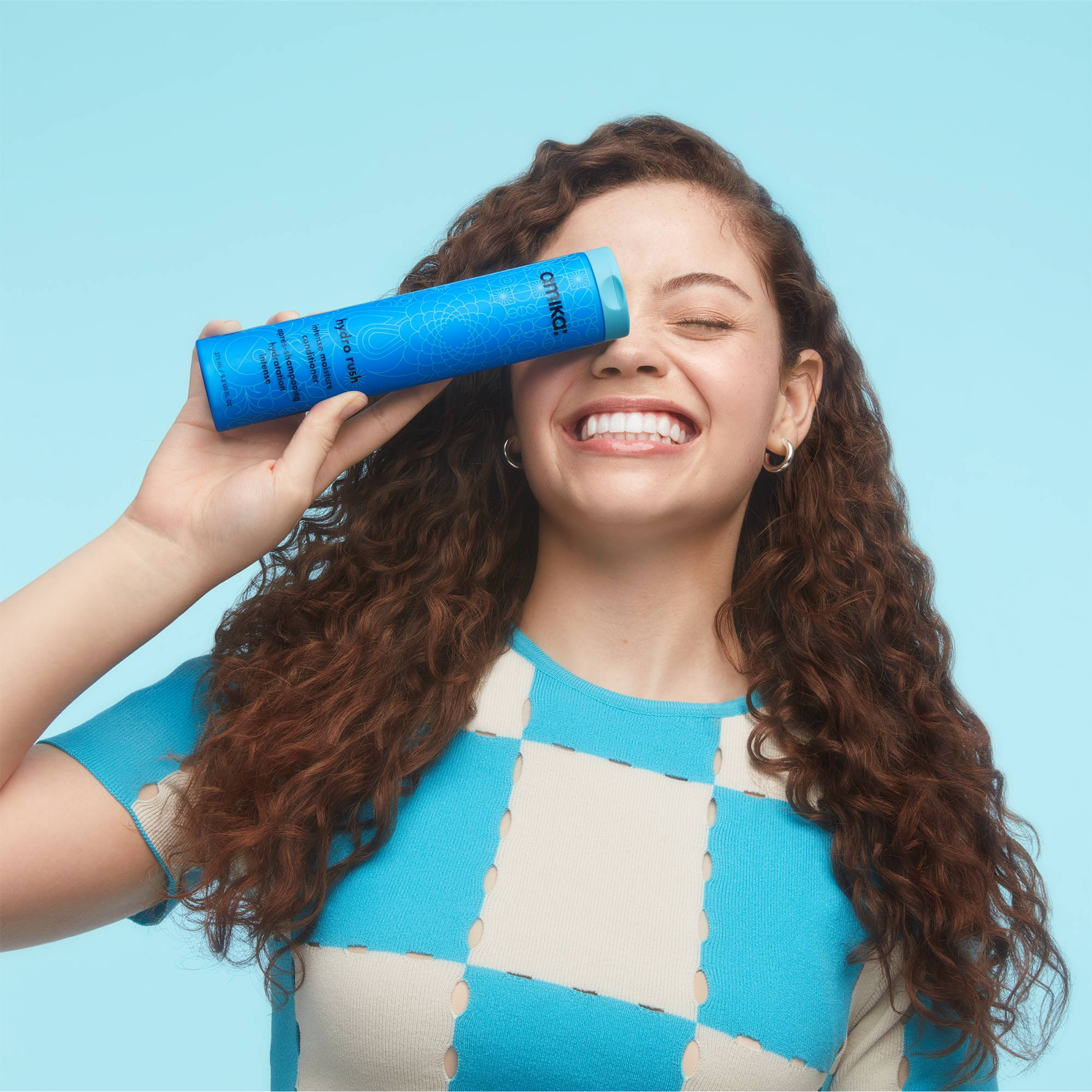 Amika Hydro Rush Intense Moisture Conditioner in a sleek bottle, designed to hydrate and nourish hair effectively.