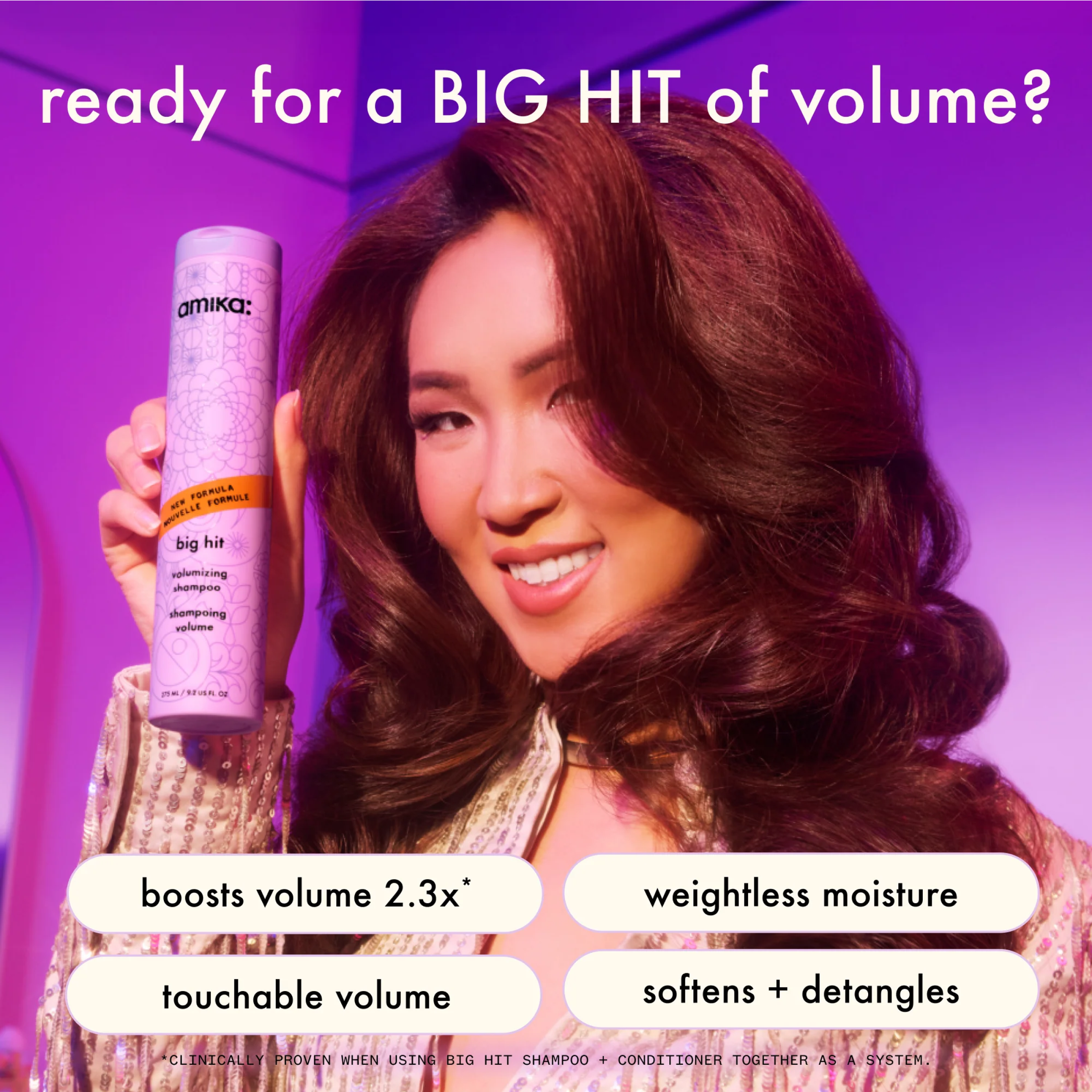 Amika Big Hit volumizing conditioner in a sleek bottle, designed to add volume and boost hair fullness.