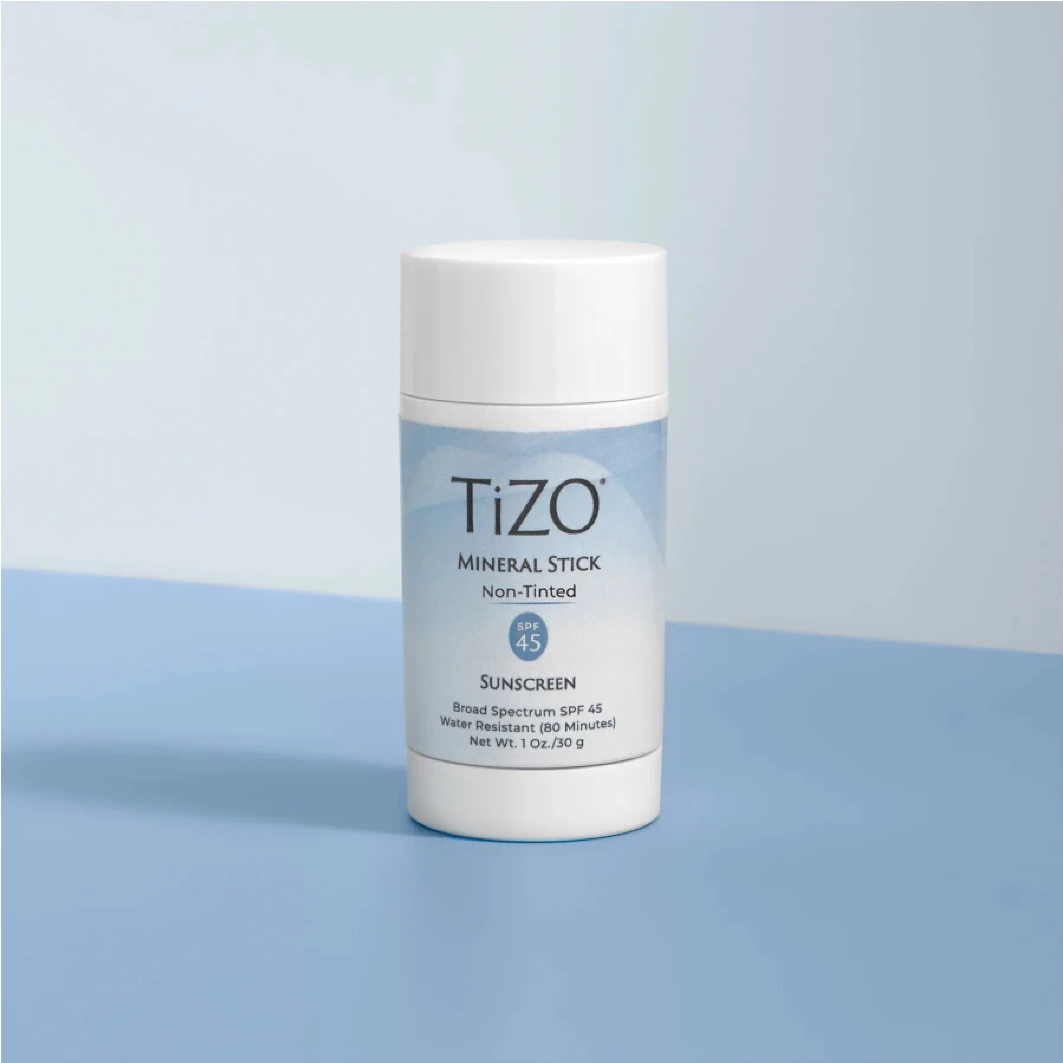 wedoskin TiZO® Mineral Stick SPF 45 tinted mineral sunscreen stick for face, showing the tinted formula in a compact container