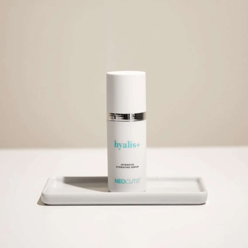 Neocutis Hyalis+ intensive hydrating serum in a clear bottle with a pump dispenser, designed for deep skin hydration.