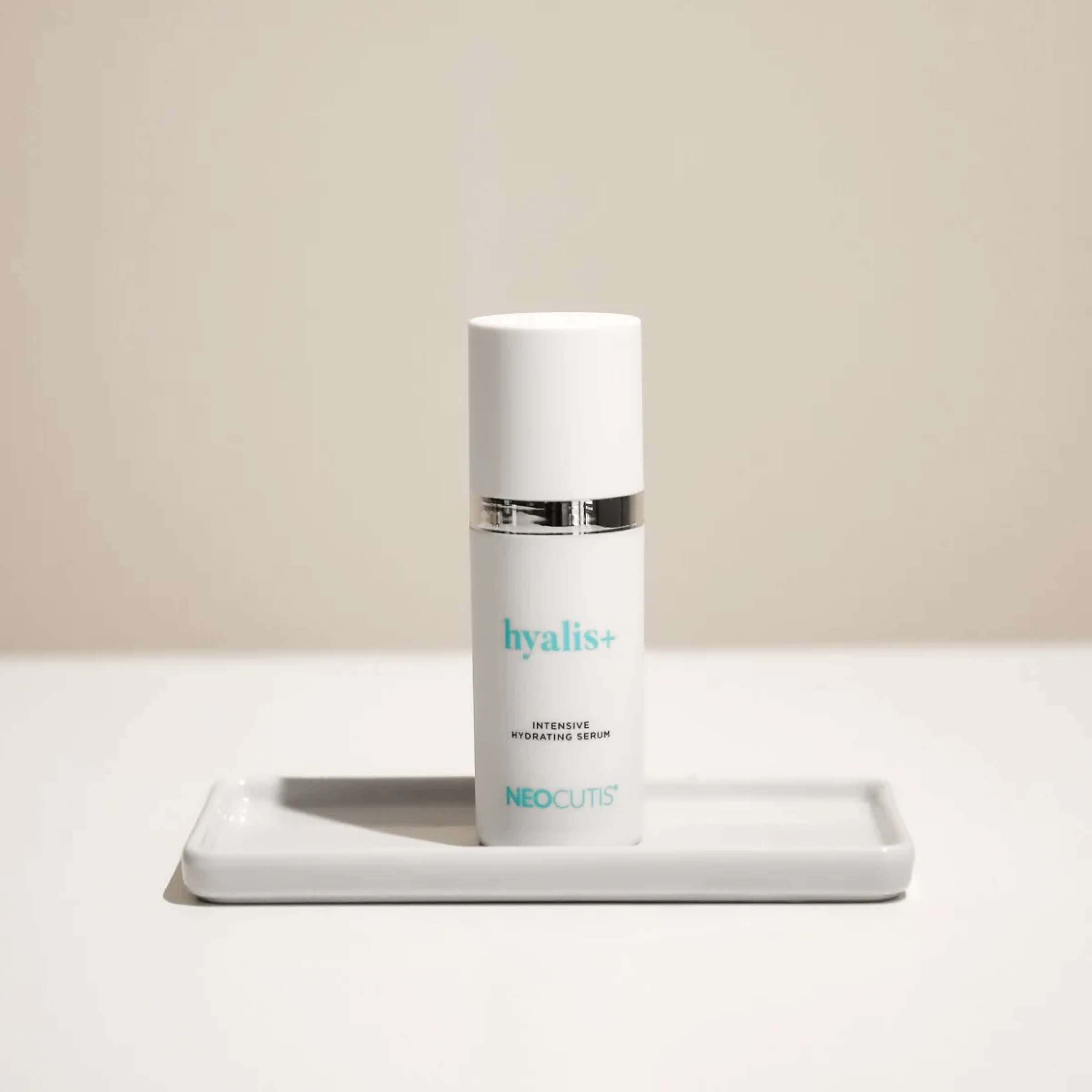 Neocutis Hyalis+ intensive hydrating serum in a clear bottle with a pump dispenser, designed for deep skin hydration.