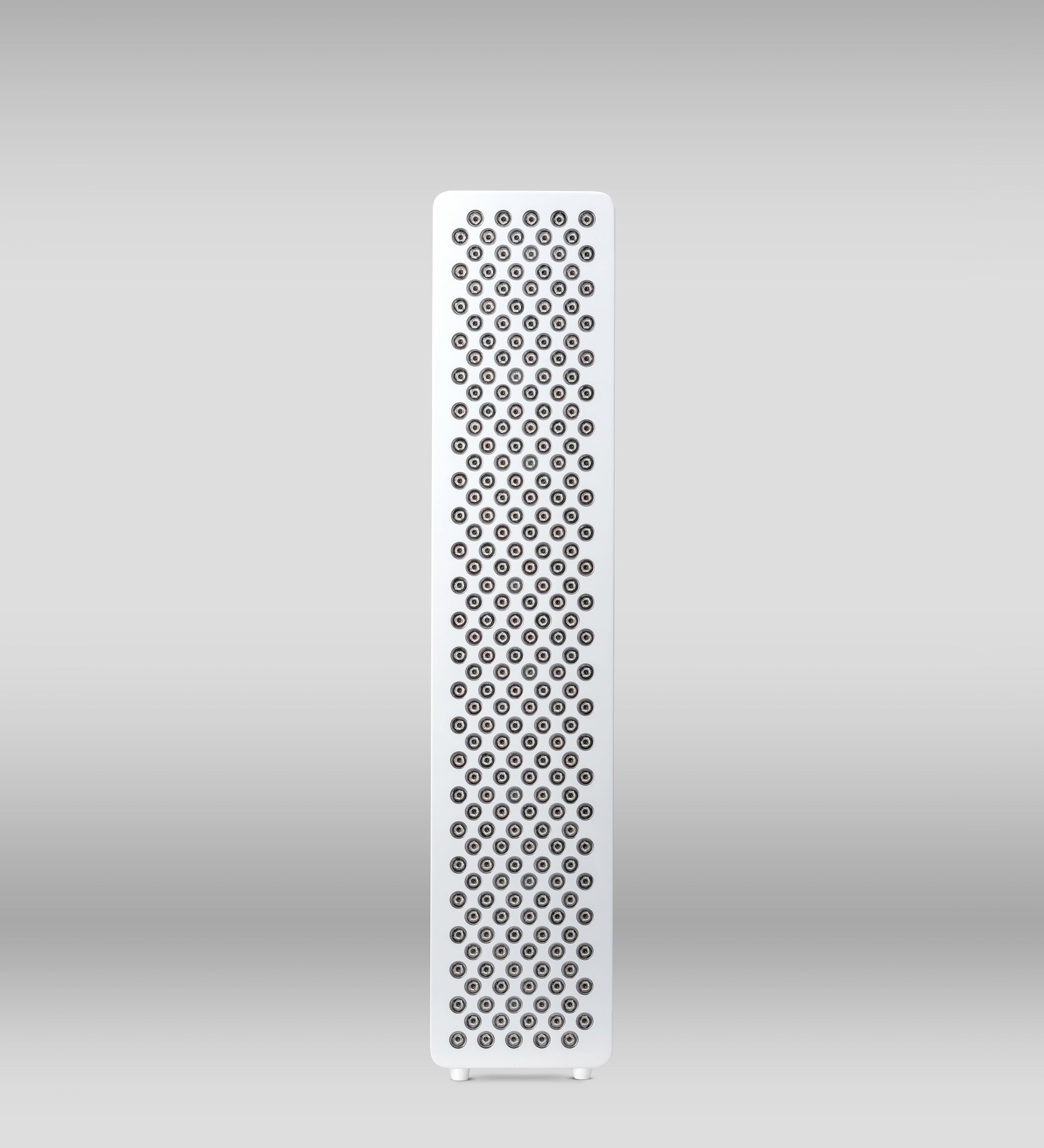Red light therapy device Orion One Plus, with sleek design and red LED lights, used for skin and wellness treatments.