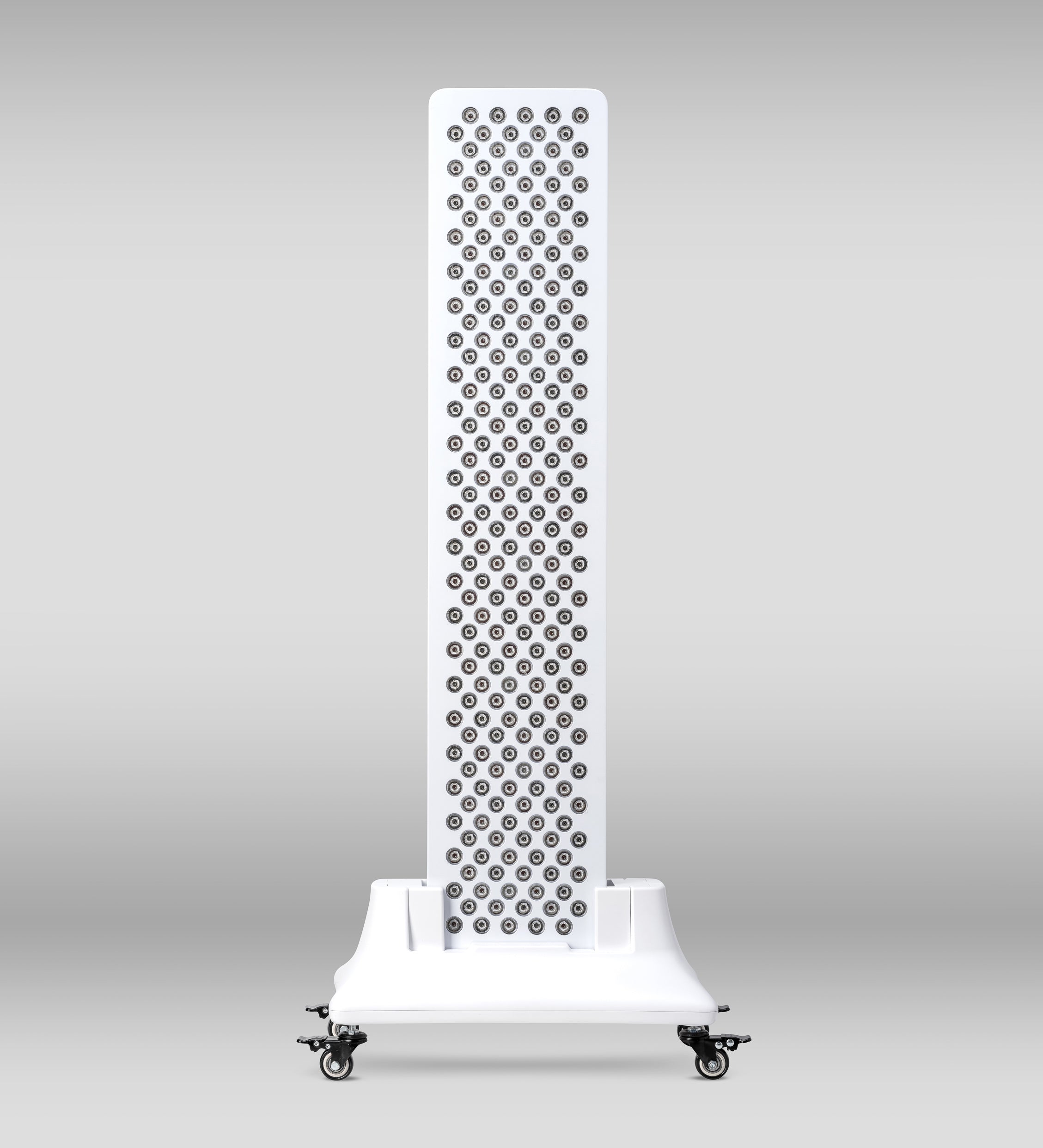 Orion One Plus red light therapy device with stand, designed for targeted skin and pain treatment, positioned on a clean surface.