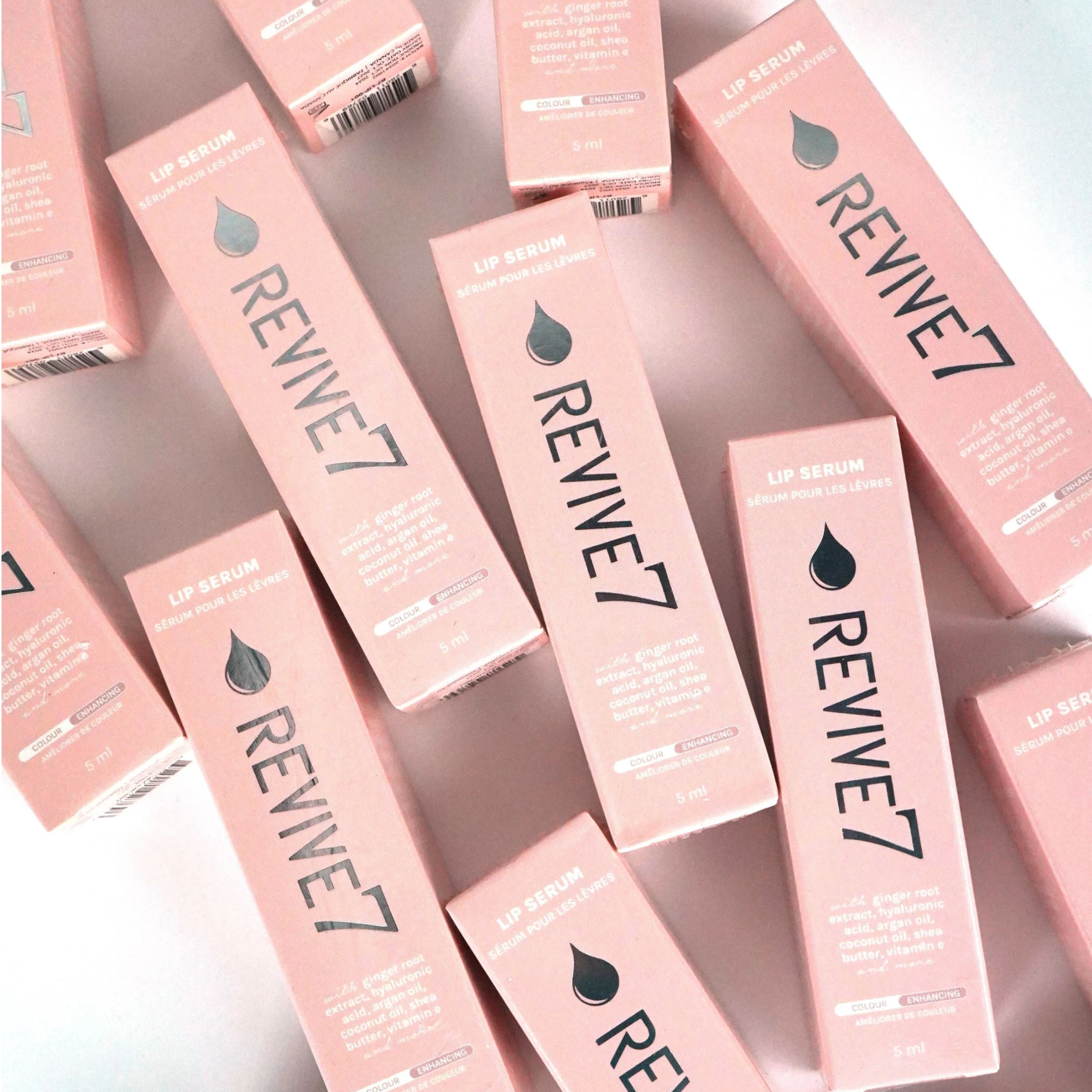 Wedoskin Revive7 Lip Serum in Passion Pink, shown in a box, designed for lips with a smooth, nourishing formula.