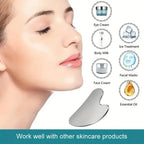 Stainless steel Gua Sha facial tool from MediSpa Aesthetica Shop, showing a smooth, curved design for facial massage.