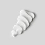 Cream texture of SACHAJUAN Finish Cream styling product by wedoskin, showing its smooth, thick consistency in a close-up image.