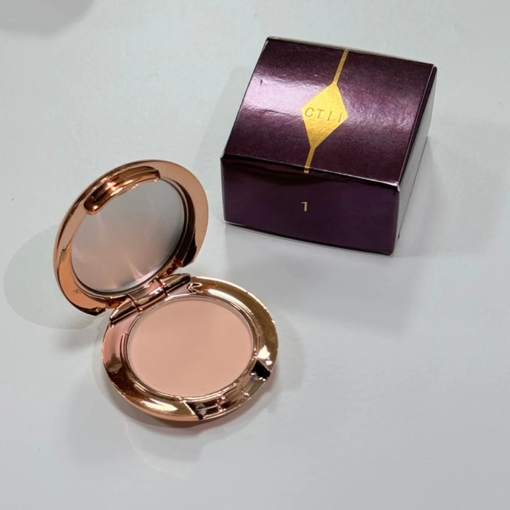 Charlotte Tilbury makeup products displayed in MediSpa Aesthetica Shop, featuring elegant packaging and a variety of beauty items.
