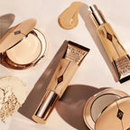 Close-up of Charlotte Tilbury makeup products displayed with MediSpa Aesthetica branding, showcasing elegant packaging and vibrant colors.