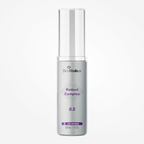 SkinMedica Retinol Complex 0.5 bottle with dropper, a skincare product in a white and gold box for anti-aging and skin renewal.