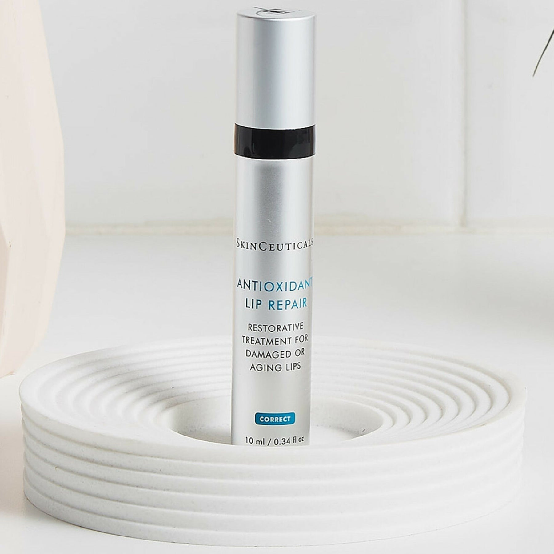 SkinCeuticals Antioxidant Lip Repair tube showing the lip treatment product, designed for lip hydration and antioxidant protection.