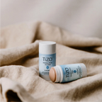 TiZO Mineral Stick SPF 45 tinted sunscreen by wedoskin, showing the compact stick with tinted mineral formula and packaging.