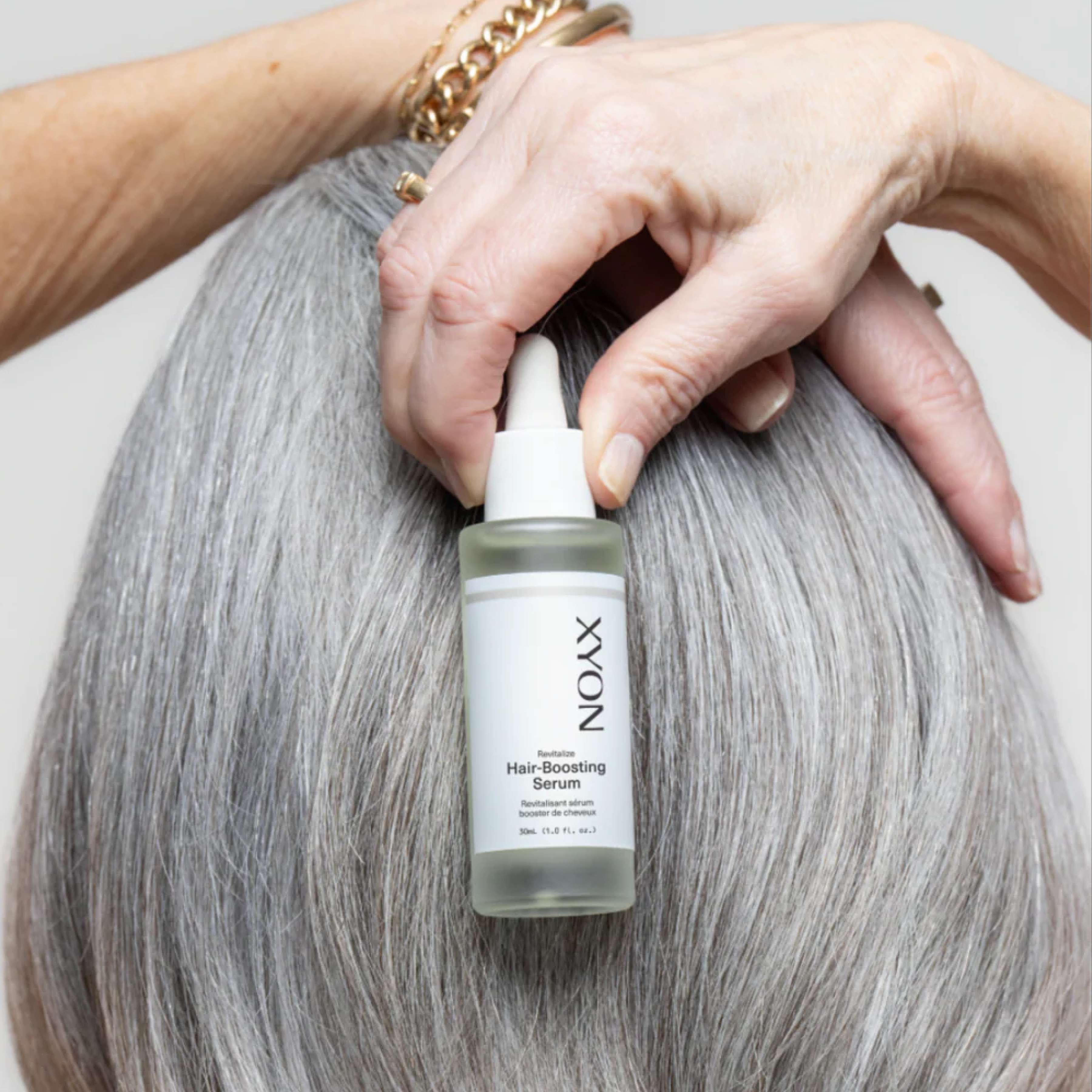 XYON Revitalize hair-boosting serum for women, in a sleek bottle, designed to strengthen and rejuvenate damaged hair.