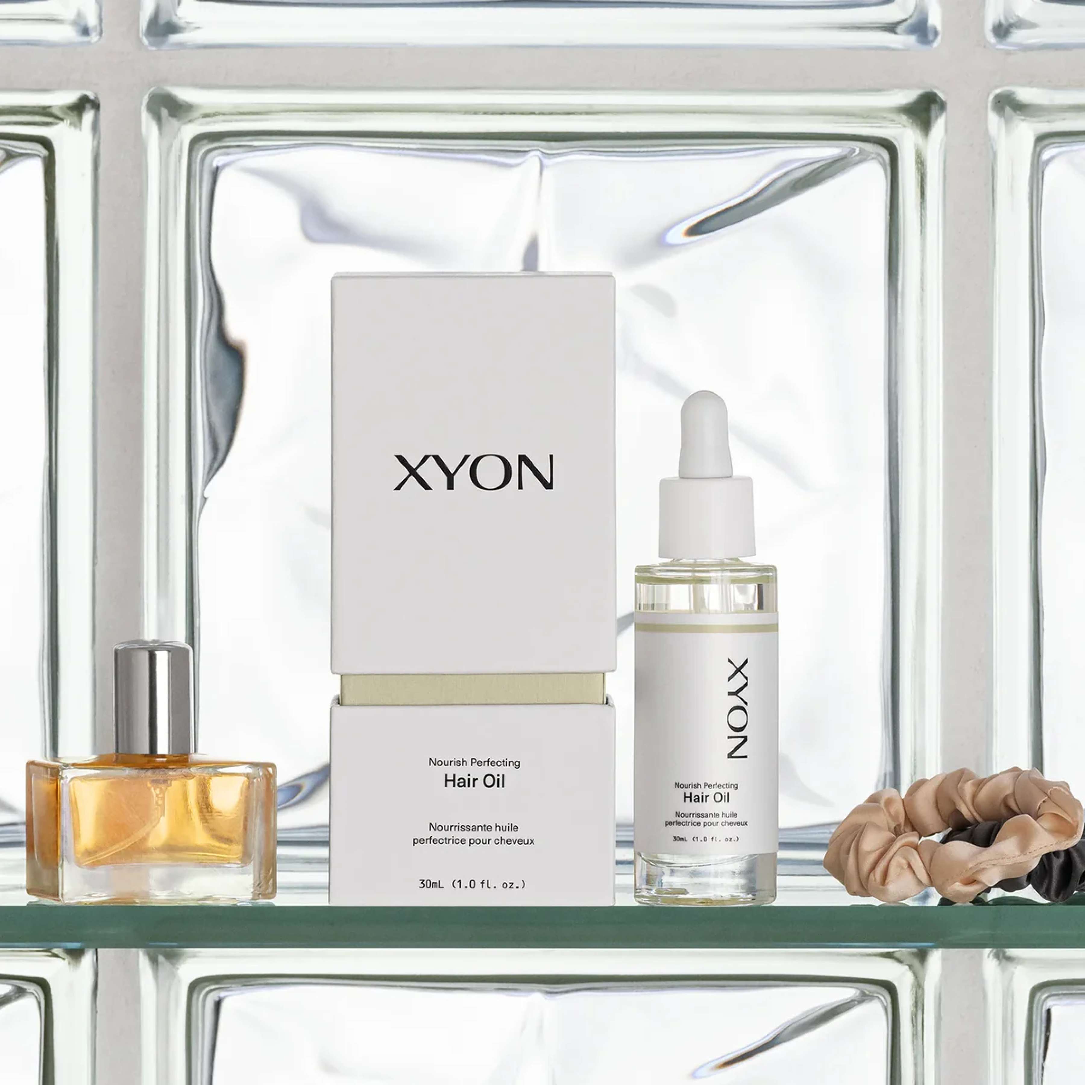 XYON Nourish Perfecting Hair Oil by wedoskin, a hair repair treatment with shiny, healthy-looking hair visible in the image.