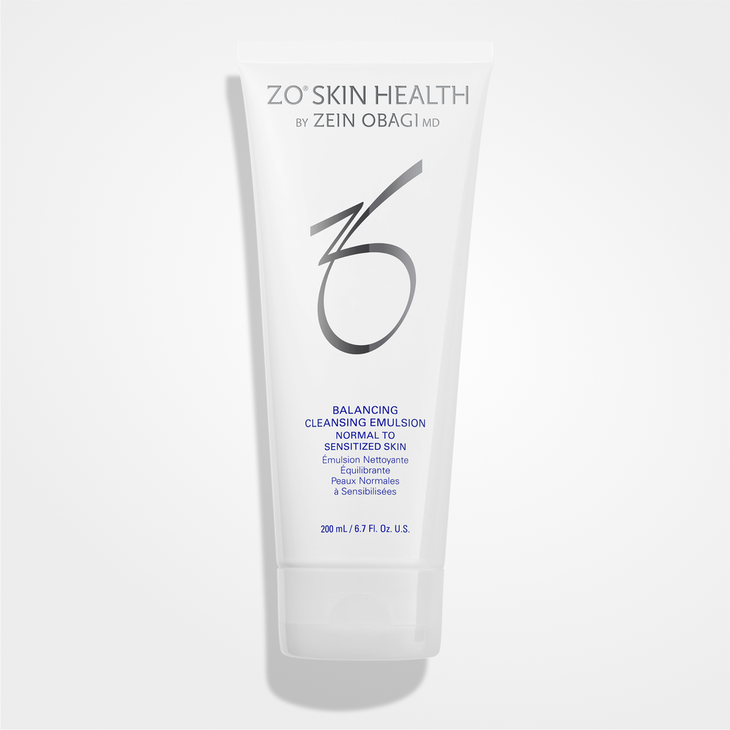 Wet skin with ZO Skin Balancing Cleansing Emulsion from wedoskin, a gentle facial cleanser in a white bottle.