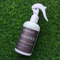 OC Beauty Co. Solstice linen and body spray bottle with a sleek design, perfect for freshening up your space and skin.