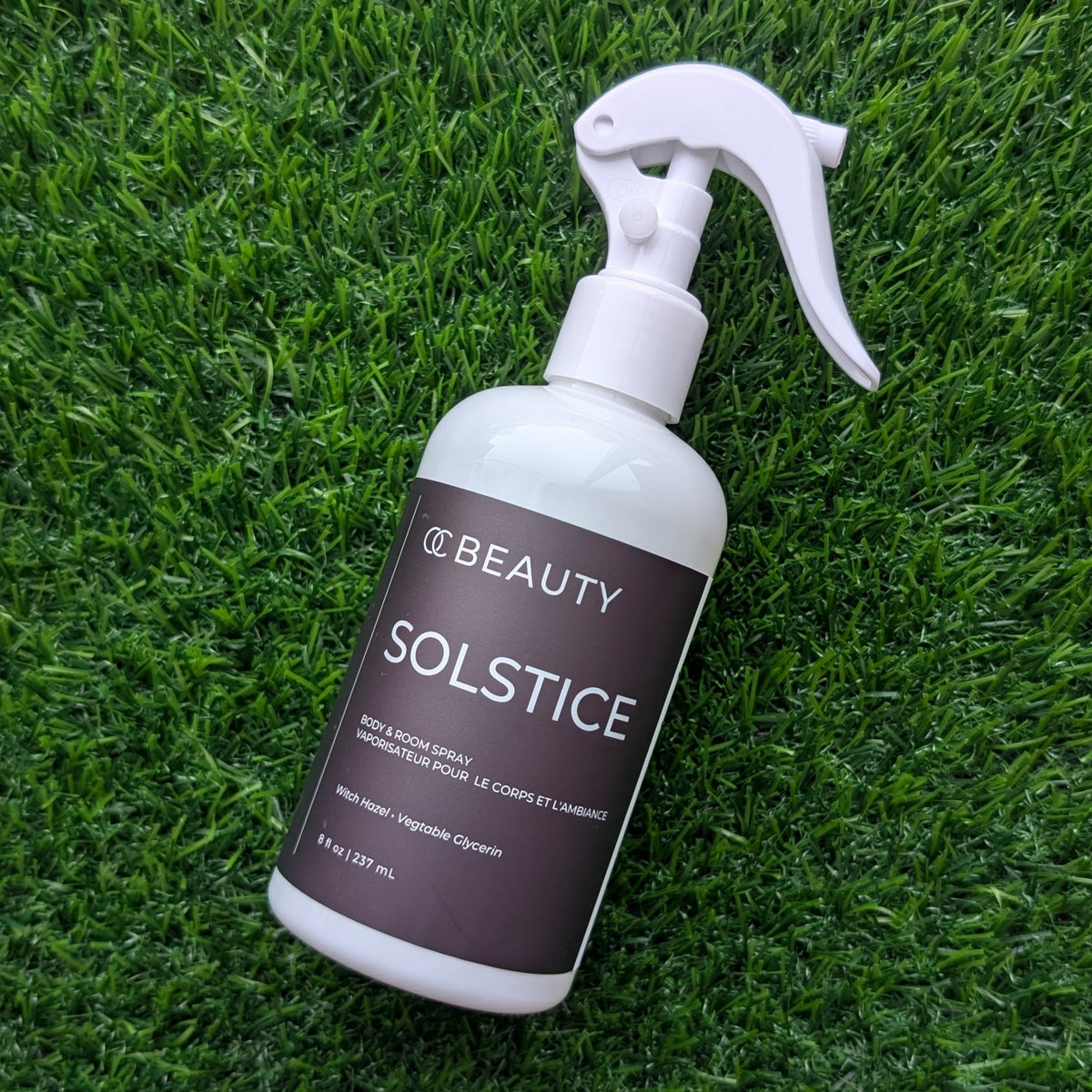 OC Beauty Co. Solstice linen and body spray bottle with a sleek design, perfect for freshening up your space and skin.