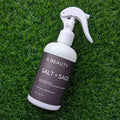 OC Beauty Co. Salt + Sage linen and body spray bottle with a sleek design, perfect for freshening up linens and personal use.